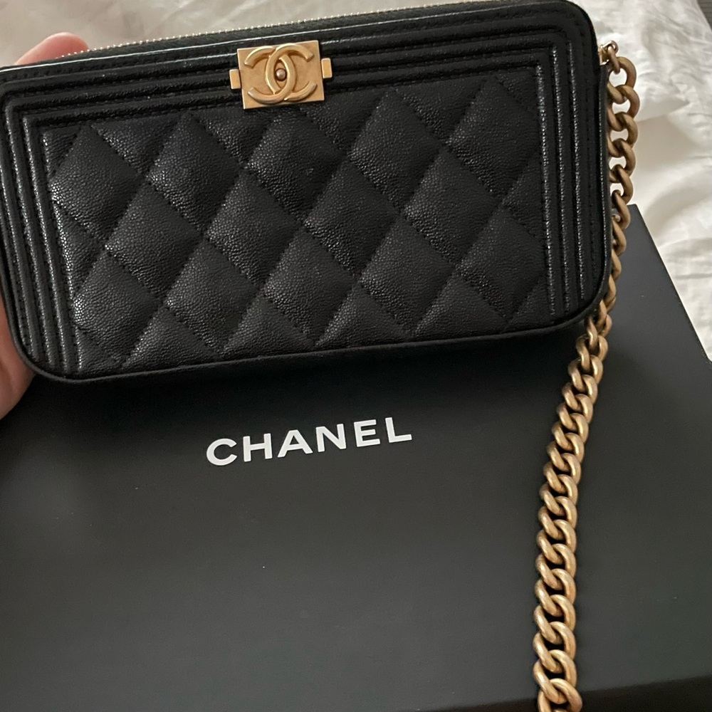 Black Chanel wallet on a gold chain